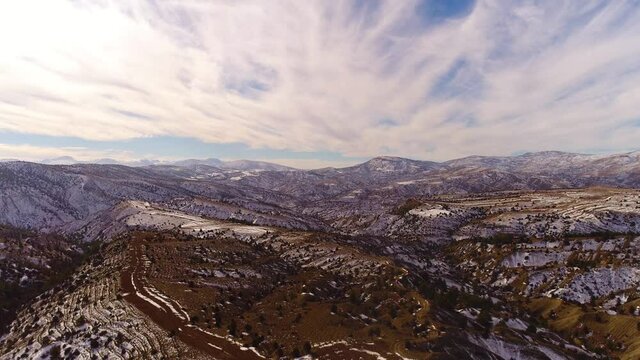 Aerial frone flight over beautiful snowy mountains in Turkey. 4k.