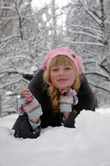 cute girl with cheeks rosy from frost in the snow