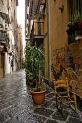 Naples, Italy, December 10, 2020. An old street in the historic city center on a winter day.