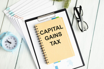 Capital gains tax-text label in the form of a document Registrar planning folder.