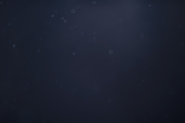 blue snowfall bokeh background, abstract snowflake background on blurred abstract blue