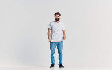 man in white t-shirt and jeans emotions motion studio lifestyle isolated background