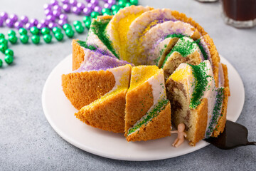 King Cake with traditional decoration for Mardi Gras with baby