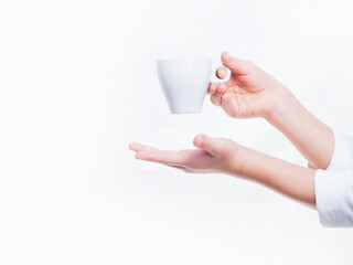 hands with an espresso Cup on a white background