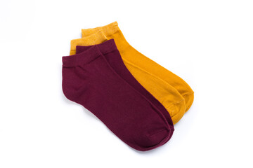 two pairs of colored short socks on a white background, top view