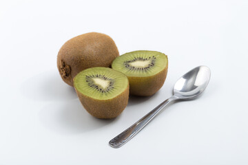 Green kiwi on white background © Veronica Glez