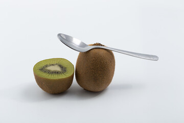 Green kiwi on white background © Veronica Glez