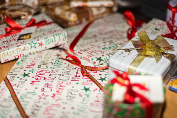 Christmas presents in colorful wrapping paper in close-up.