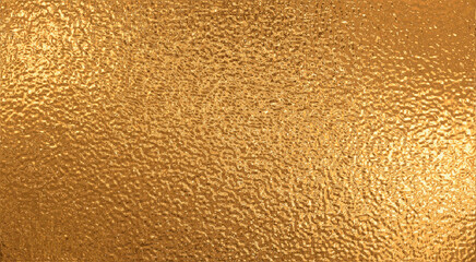 Naklejka premium Rough golden metallic film, abstract background.