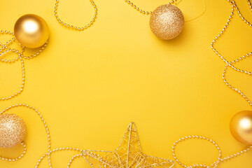 Christmas gold decorations a on Illuminating pantone colored background.