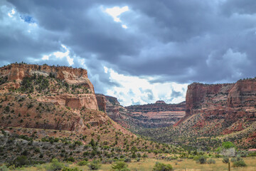 Fototapeta na wymiar Colorado National Monument in stormy skies. Red sandstone plateaus seen as storm clouds hover near Grand Junction, Colorado.