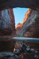 a view of a canyon through a cave