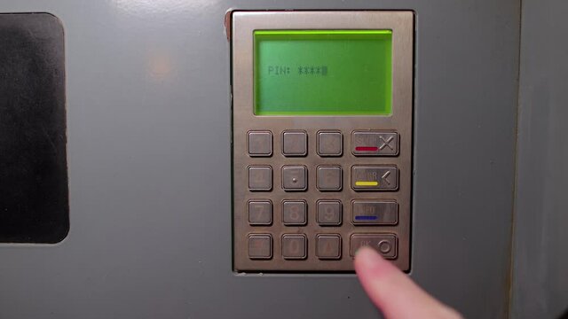 Entering pin code on an atm, first person point of view