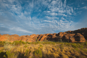 a landscape with a rock formation