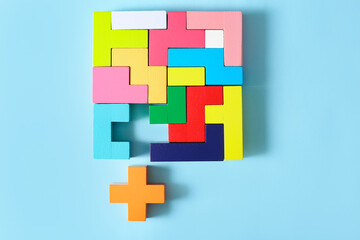Multicolored puzzle, cubes on a blue background