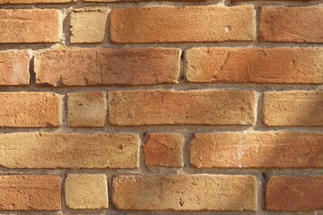 Background old red brick wall in sunny day.