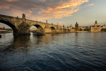 panorama stones charles bridge over vltava river and blue sky at sunset in the center of prague