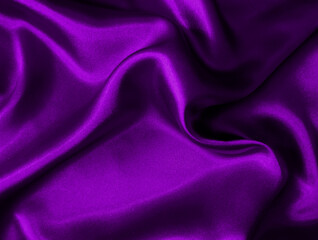 Shiny purple crumpled fabric texture. Elegant wavy cloth background