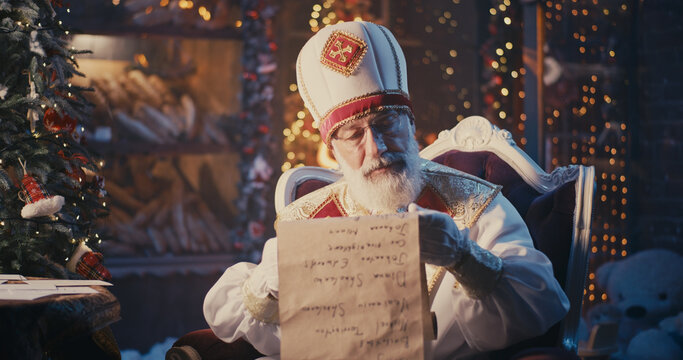 Saint Nicholas reading letters and checking list