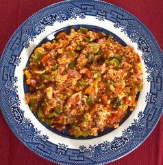 Top view of traditional breakfast dish made of mixing tomatoes pepper and eggs