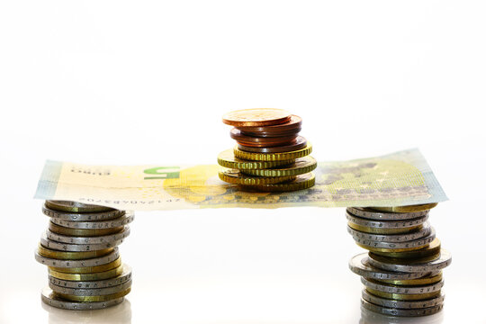 Closeup Shot Of Euro Note And Coins On White Background