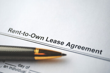 Legal document Rent-to-Own Lease Agreement on paper close up