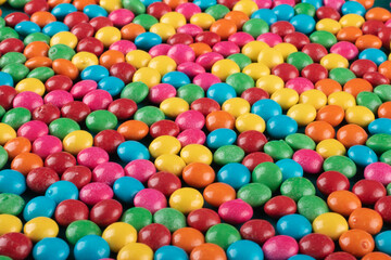 Colorful Confetti candy background texture top view.