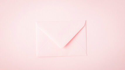 Light pink envelope on pink panorama background