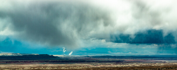  smoke stacks fog over the mountains