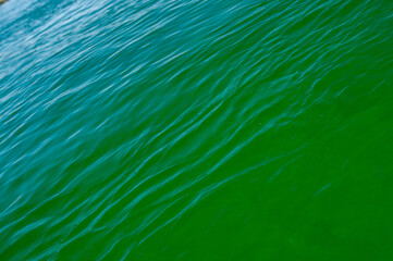 blue and green water surface 