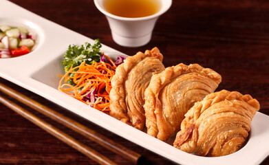 Thai Curry Puff Appetizer with a Small Salad; copy space
