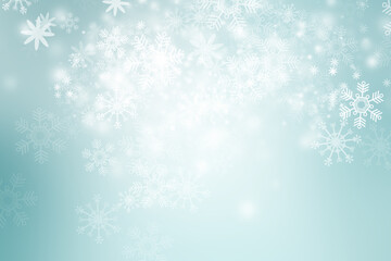 Fototapeta na wymiar White Xmas Bokeh blur background. Circle light on blue backdrop. Snowflake abstract light wallpaper.