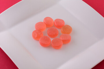 Sweet watermelon gummy candy on white snack plate