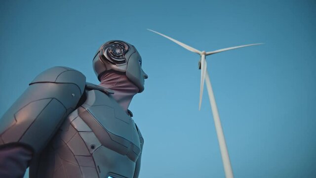 Future technology. Cyborg. Blue futuristic cyber droid robotic humanoid activating outdoor against blue sky background. Robot looking at the windmill. Artificial intelligence. Internet of things