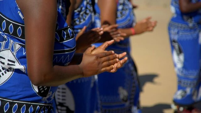 African women clapping hands, traditional choir sing and dance, slow motion