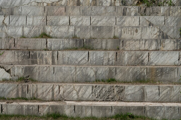 Granite stone texture, large granite steps in the quarry, background