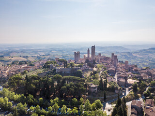 Aerial view of San Gimignano skyline at sunrise, a medieval town with ancient towers in Tuscany, Italy