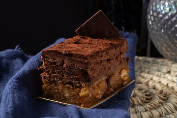 Sofia dessert with layers of chocolate mousse and caramelized peanuts covered with cocoa powder