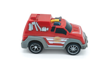 Novosibirsk, Russian Federation, April 05, 2020: children's toy fire truck, close-up on a white background