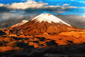 Parinacota is dormant stratovolcano, the part of Nevados de Payachata chain of volcanos located in Central Volcanic Zone of Andes, Chile