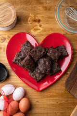 chocolate brownies on red heart shaped dish