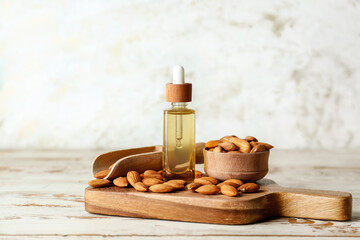 Composition with almond oil on table