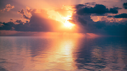 Seascape with a beautiful sunset on the horizon.
