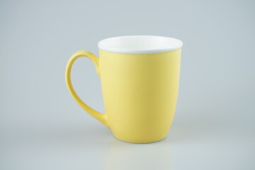 Yellow mug isolated on white background 