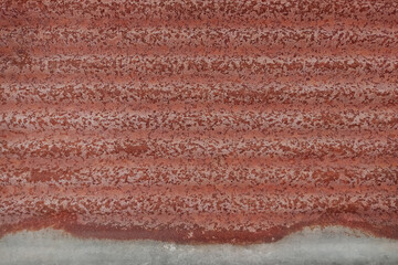 Wall rusty corrugated iron metal  texture or Background of old zinc and rust.