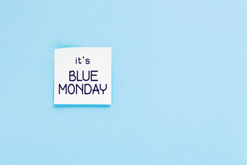 Blue monday text. Sticker on blue wall. Most depressing and saddest day of the year. Blue monday concept. Copy space.