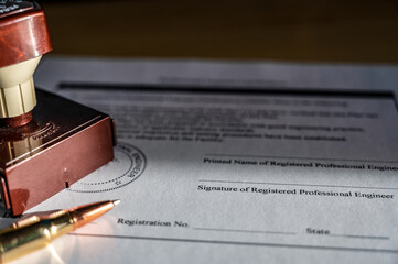 Selective focus on generic professional engineer, architecture. or surveyor stamp and certification statement