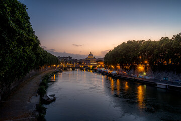 St. Peter's Basilica, Vatican City and Tiber River at sunset or dusk - Rome Italy travel and tourism 