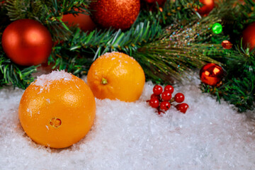 Fototapeta na wymiar Symbol of Christmas or New Year orange fruit with ornament.