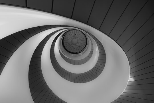 The double helix staircase in UTS Central at the University of Technology Sydney, Australia. In black and white.